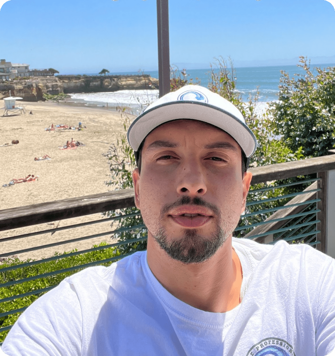 Man taking selfie on a sunny beach.