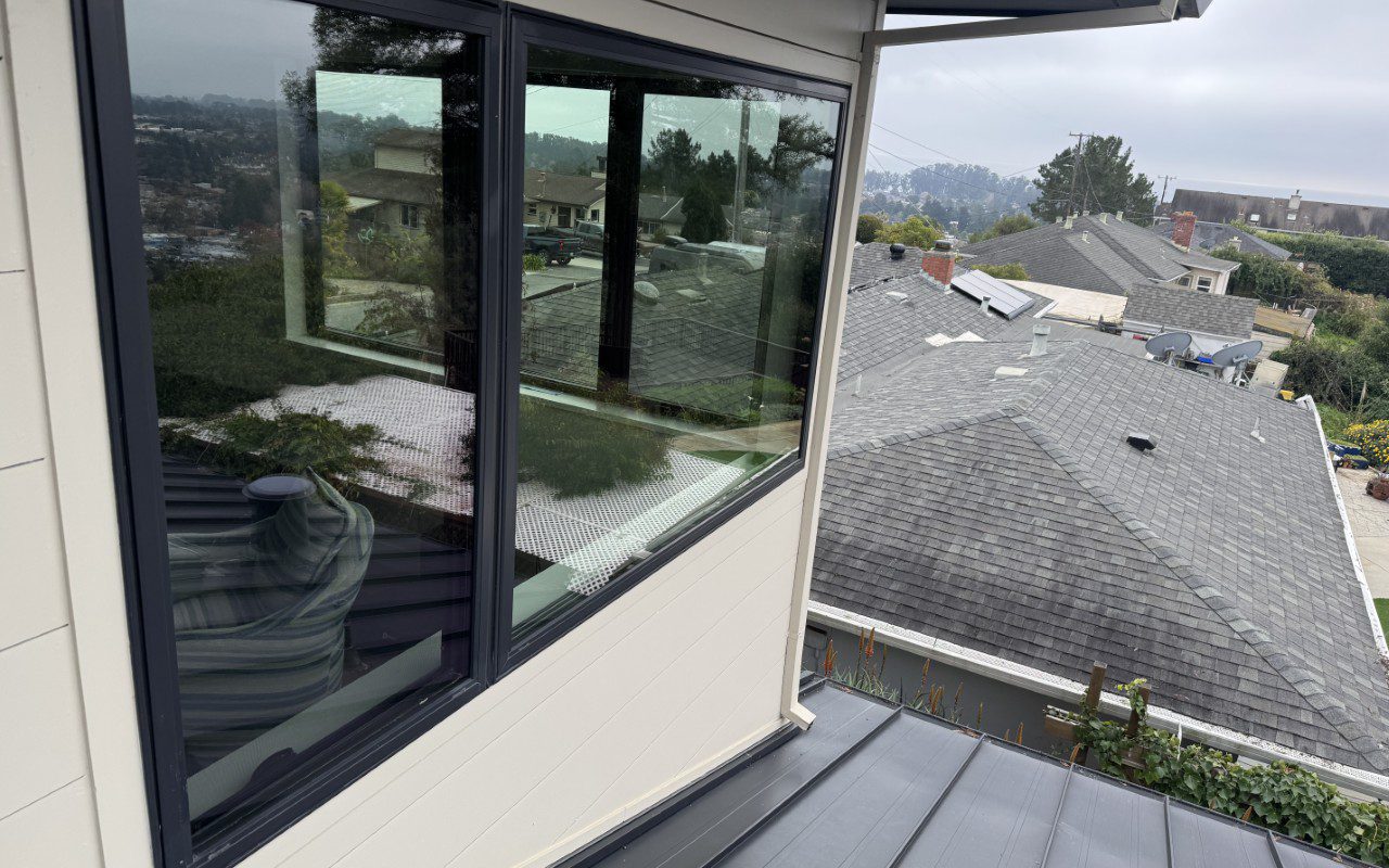 Rooftop view with reflective modern windows.
