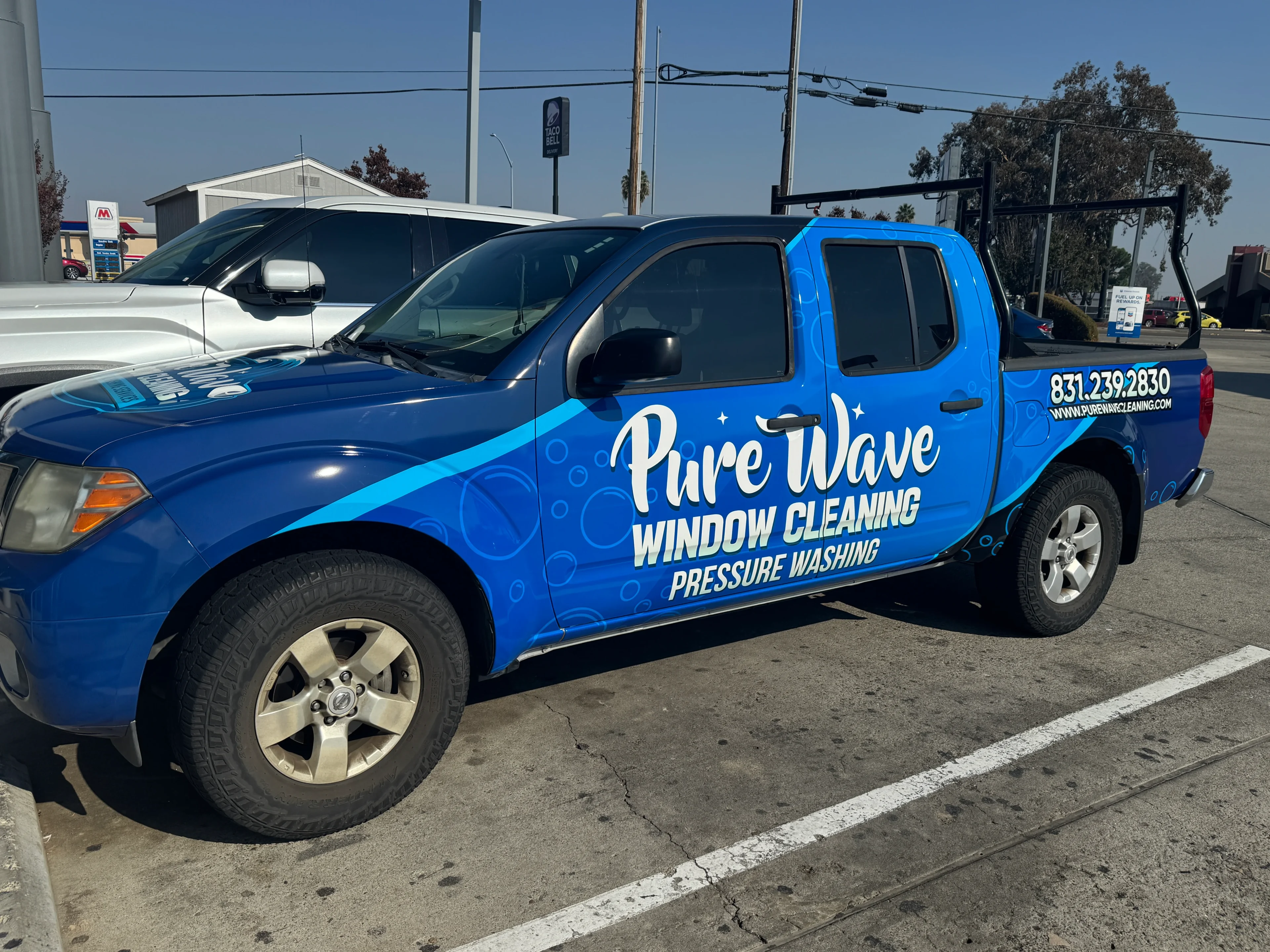 Blue truck with Pure Wave window cleaning.